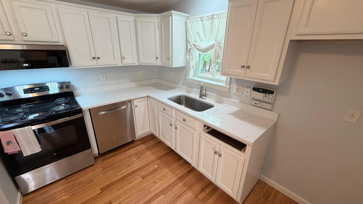 Finished kitchen with new white quartz countertops and undermount sink installed by ECR